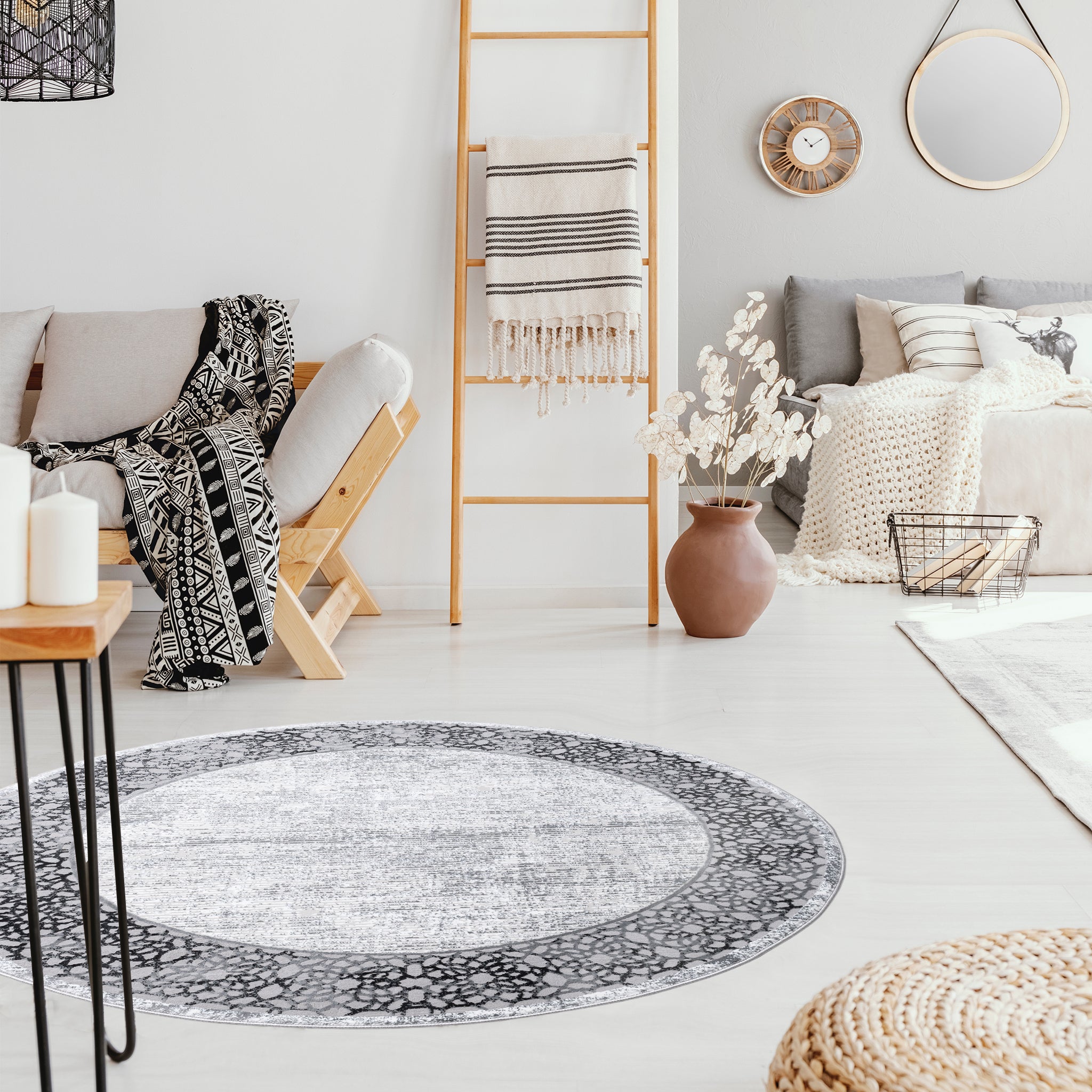Pouf and round Grey Mandala Rug in bright living room interior with ladder next to wooden couch