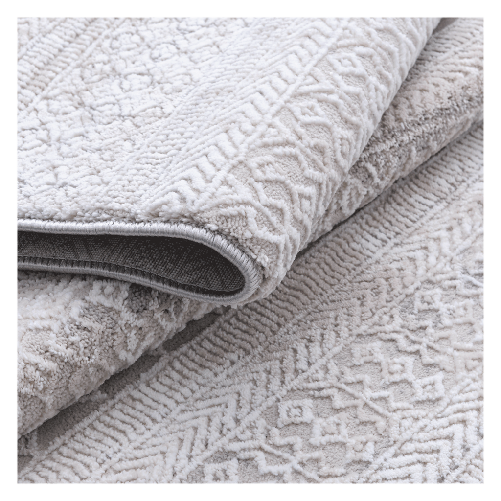 Folded Tribal Ivory Rug with tufted tribal motifs