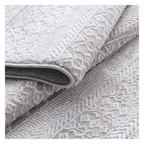 Folded Tribal Ivory Rug with tufted tribal motifs